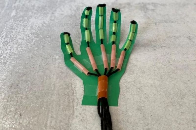 DIY robot hand built from straws and construction paper