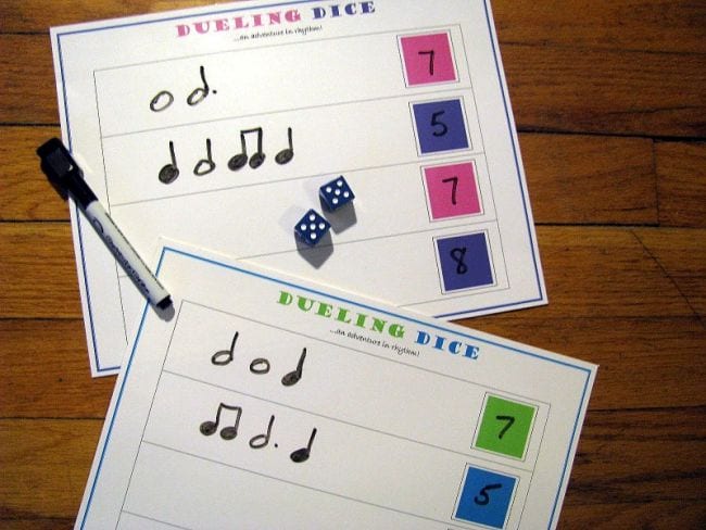 Dueling Dice worksheets with music note rhythmic notation, dice, and marker