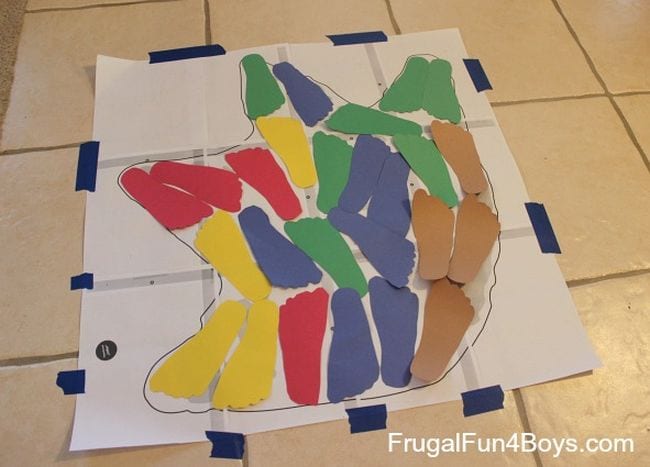 Different foot cutouts inside of a dinosaur footprint 