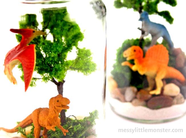 Dinosaur toys inside of mason jar