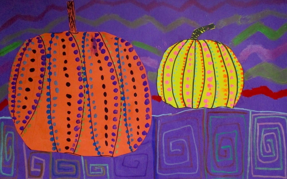 Halloween activities often include pumpkins like this one. Orange and yellow construction paper pumpkins with dotted patterns on purple background