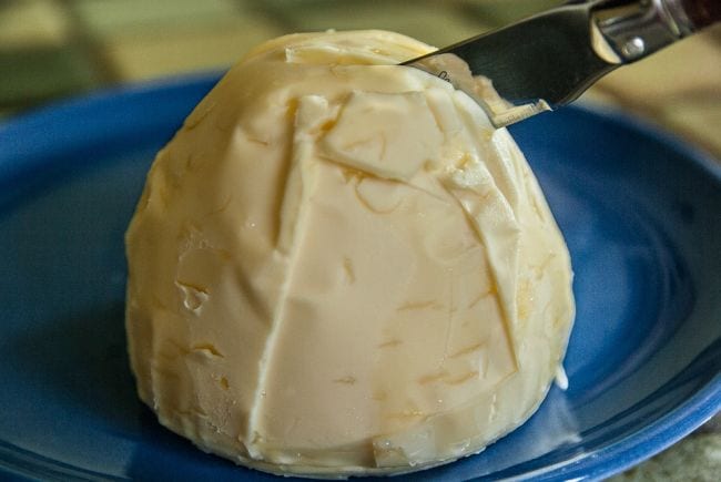Butter knife slicing through a ball of butter (Edible Science)