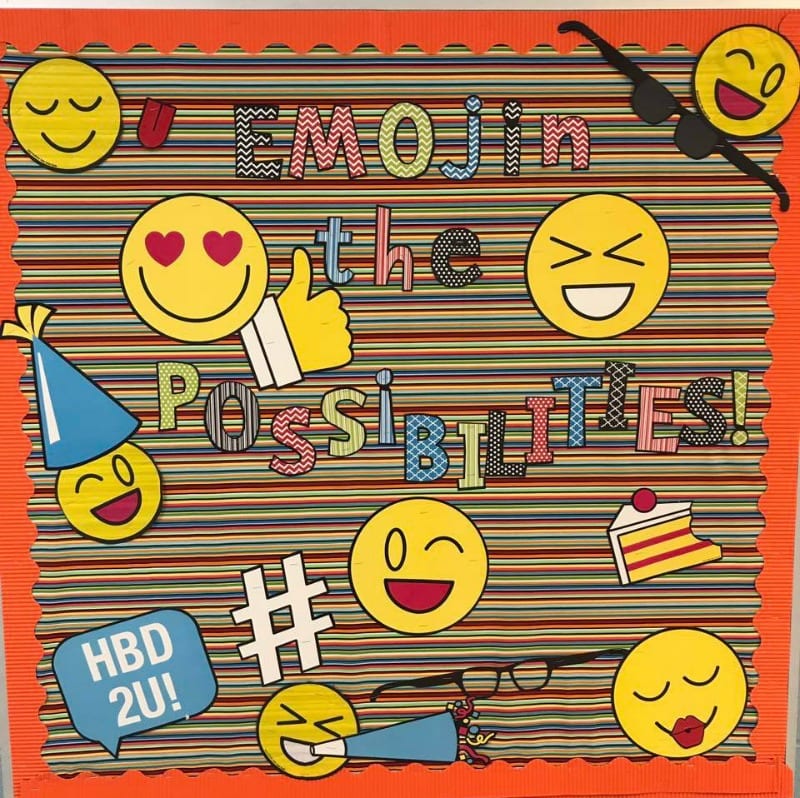Emojin the Possibilities bulletin board with various emojis