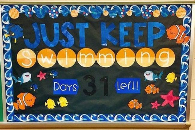A black background has waves on the perimeter. It reads Just Keep Swimming and has the number of days left on the board. There are fish, whales, and other sea creatures as well. (summer bulletin boards ideas)