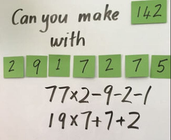 A series of numbers on green sticky notes on a whiteboard. Text reads "Can you make 142 with..." (Fifth Grade Math Games)