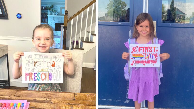 Girls holding first day of school signs