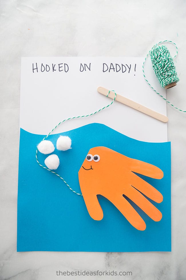 Homemade fish on a string father's day card that says hooked on daddy