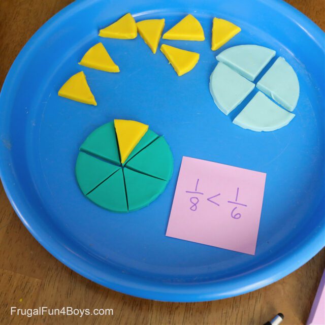 Playdough fractions on a colorful blue plate