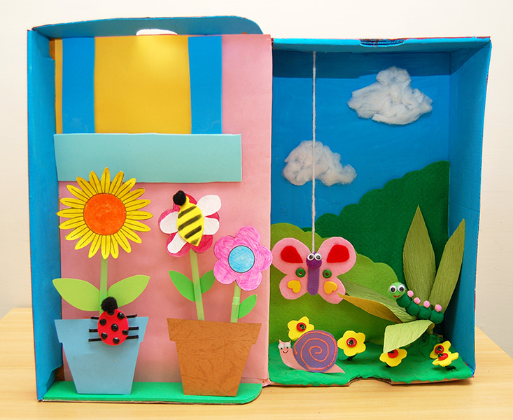 Garden scene created from shoebox and construction paper