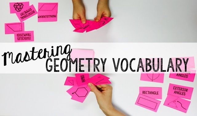 two students's hands holding a handful of geometry vocabulary cards
