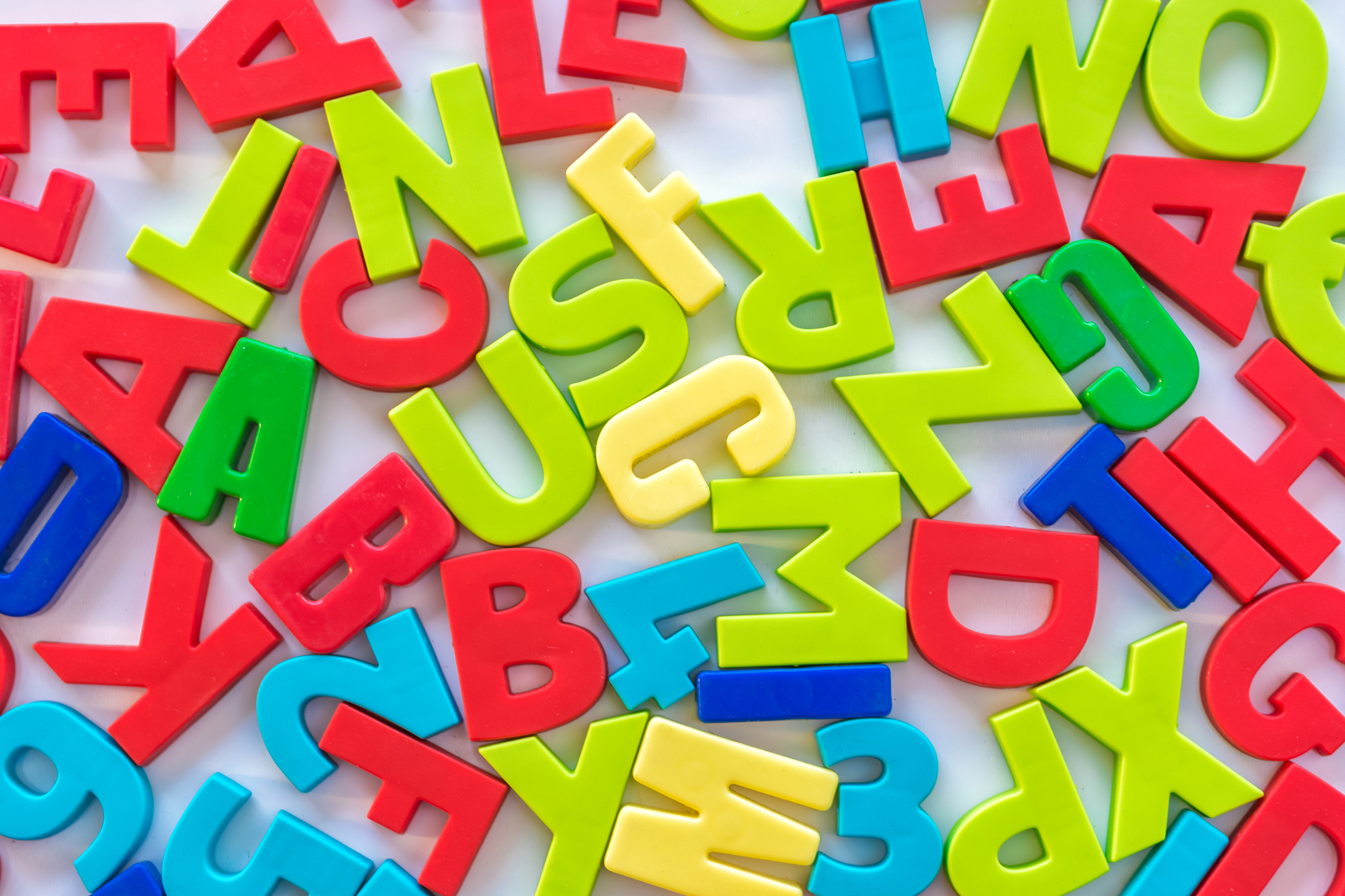 Colorful numbers and letters as background on the topic of learning and school