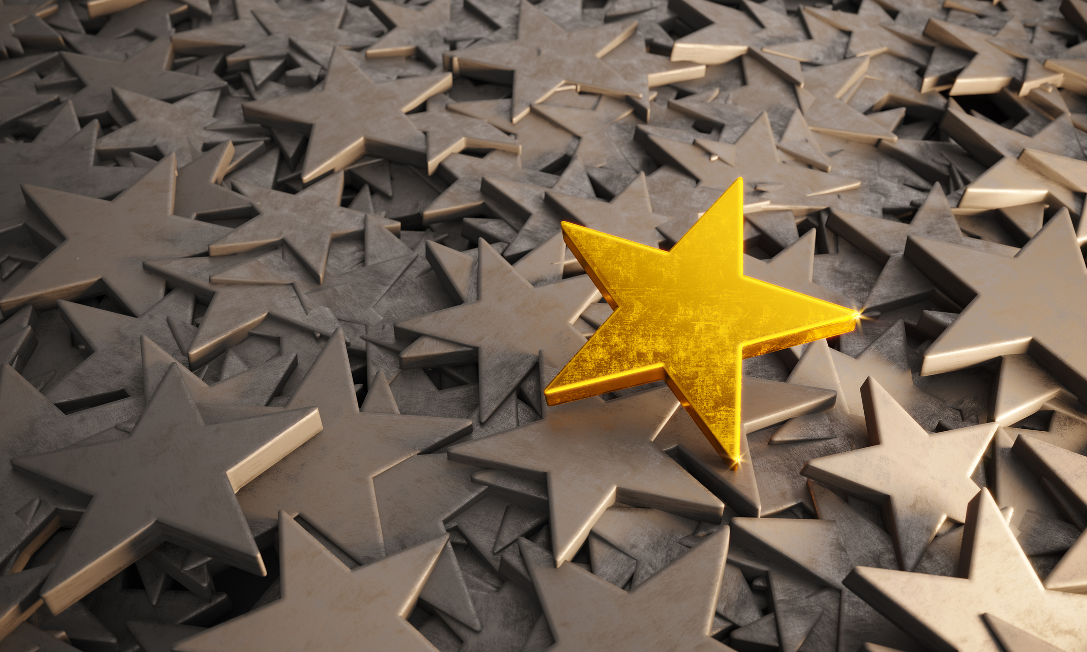 Scratched golden star standing out from gray colored stars. ( 3d render )