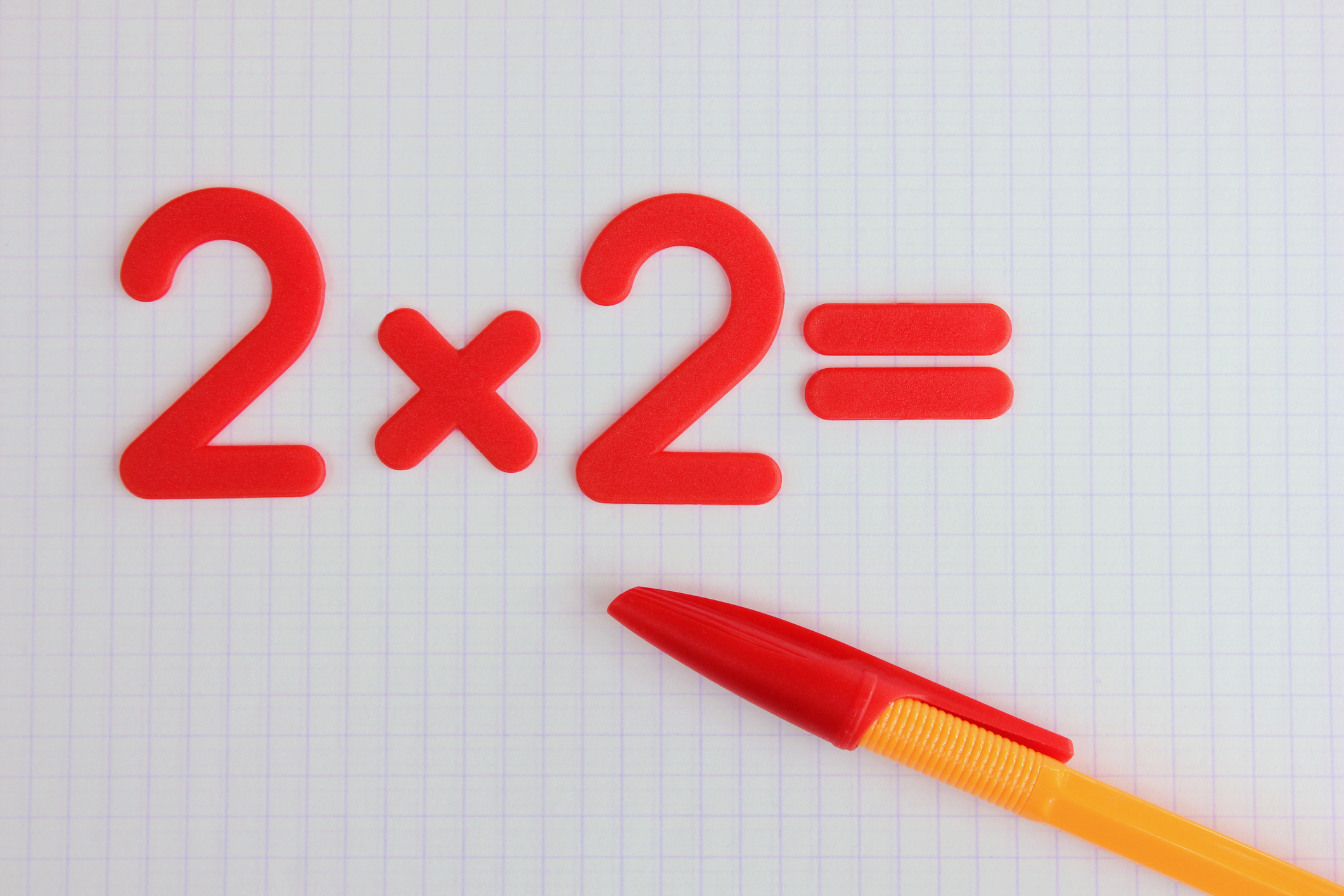 A simple mathematical example in a clean school notebook. Back to school. The concept of primary education.