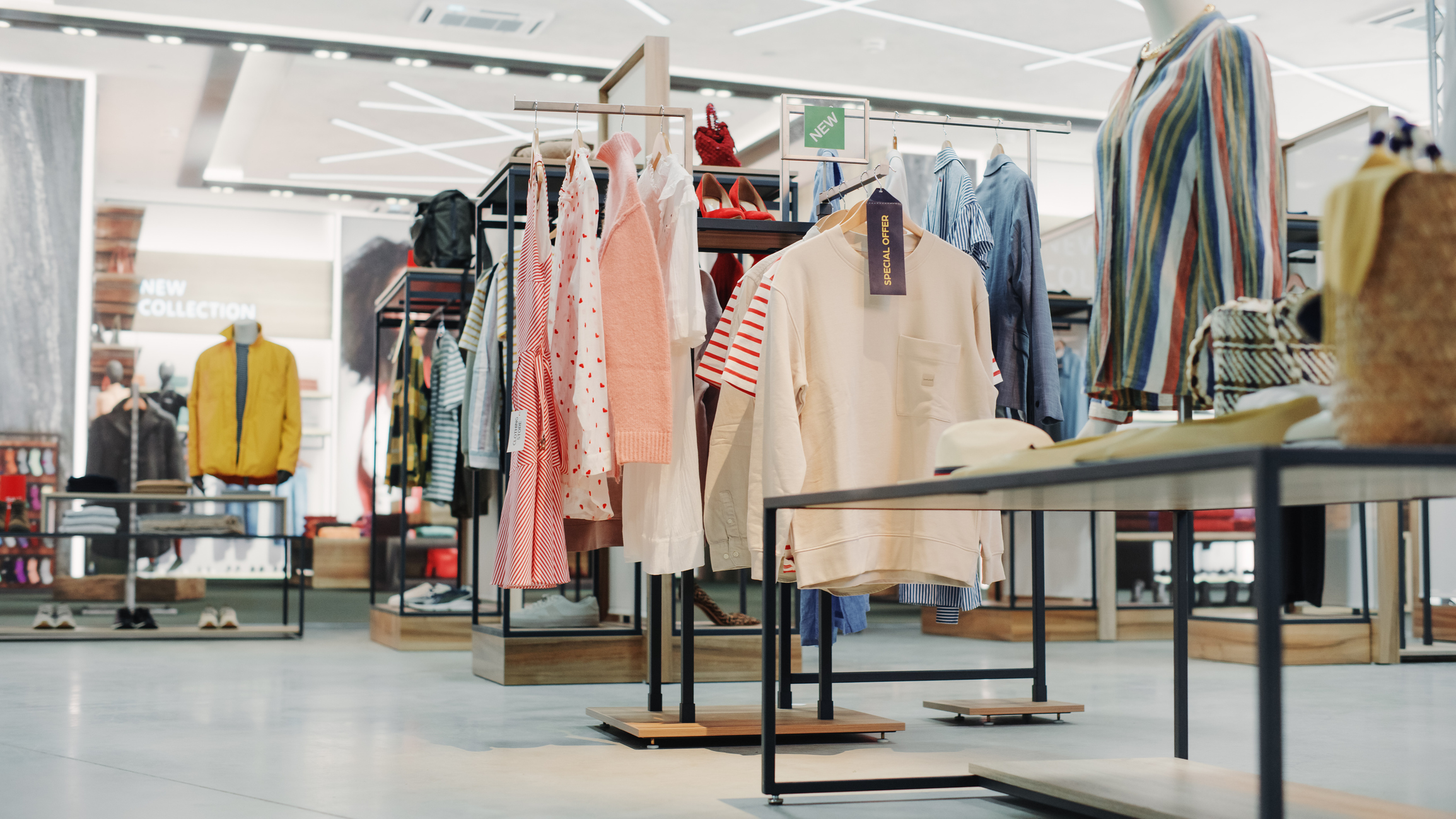 Modern clothing shop with racks of clothing