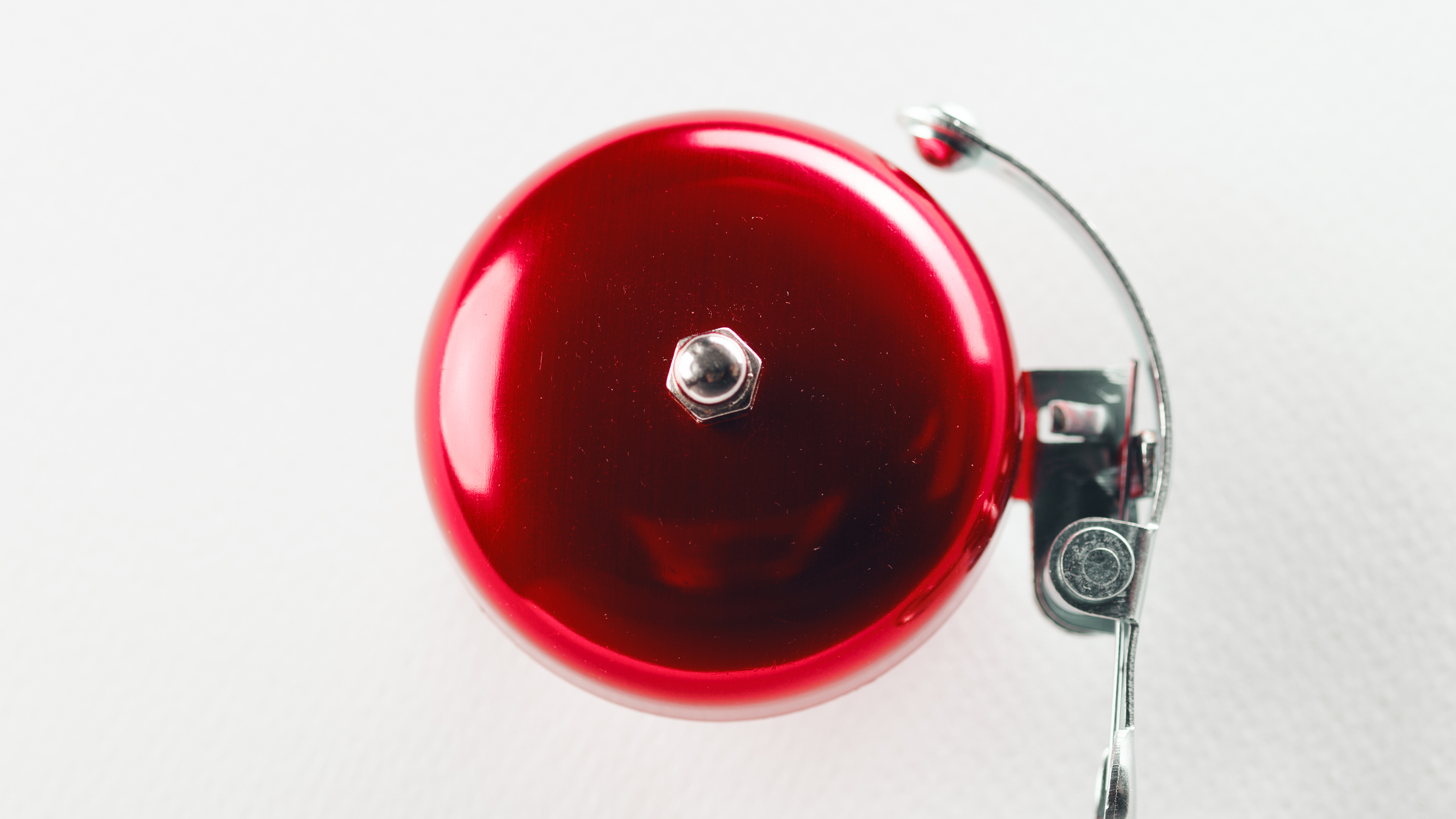 Red bell back to school on the white wall.