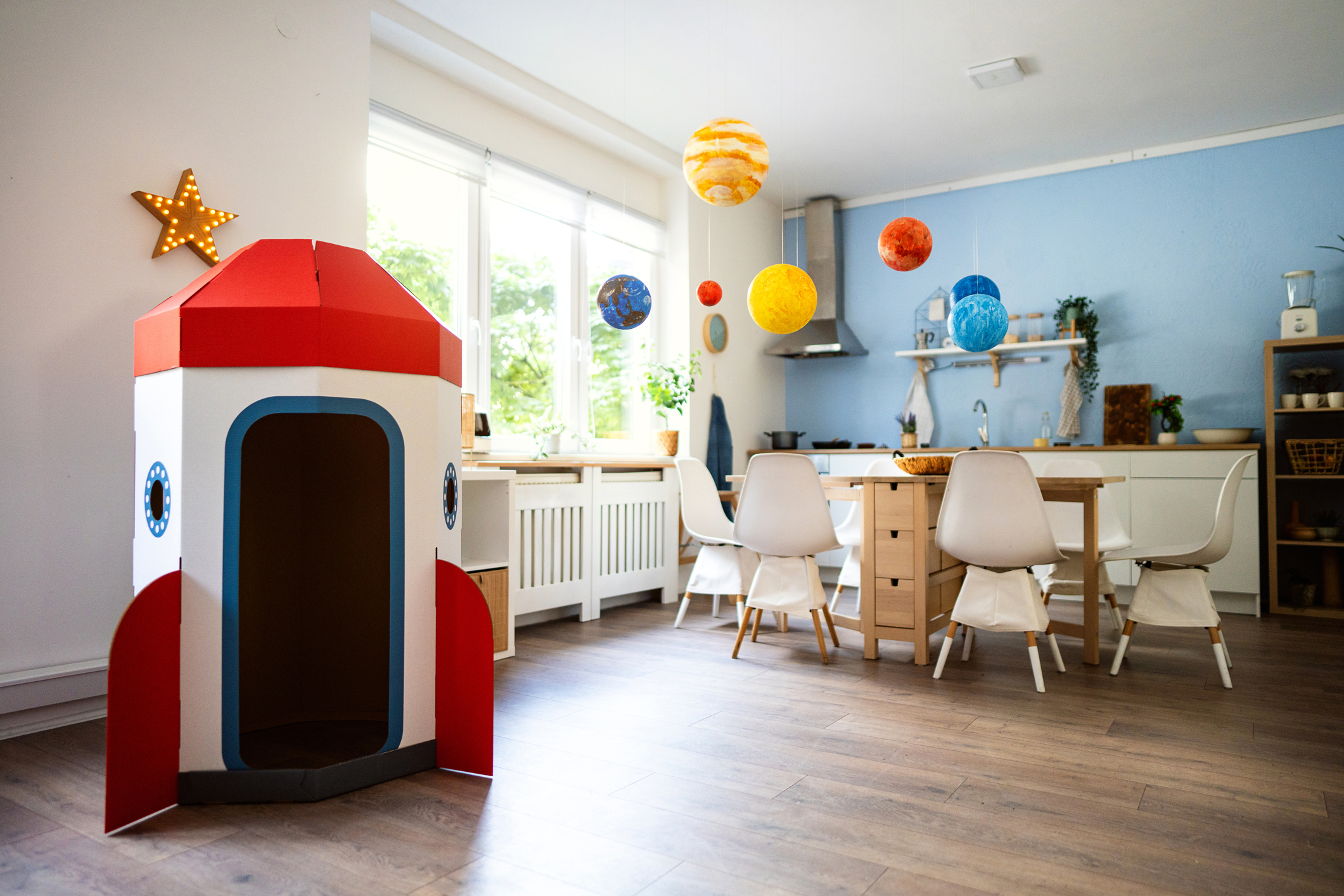 Cardboard rocket ship and wall hanging solar system