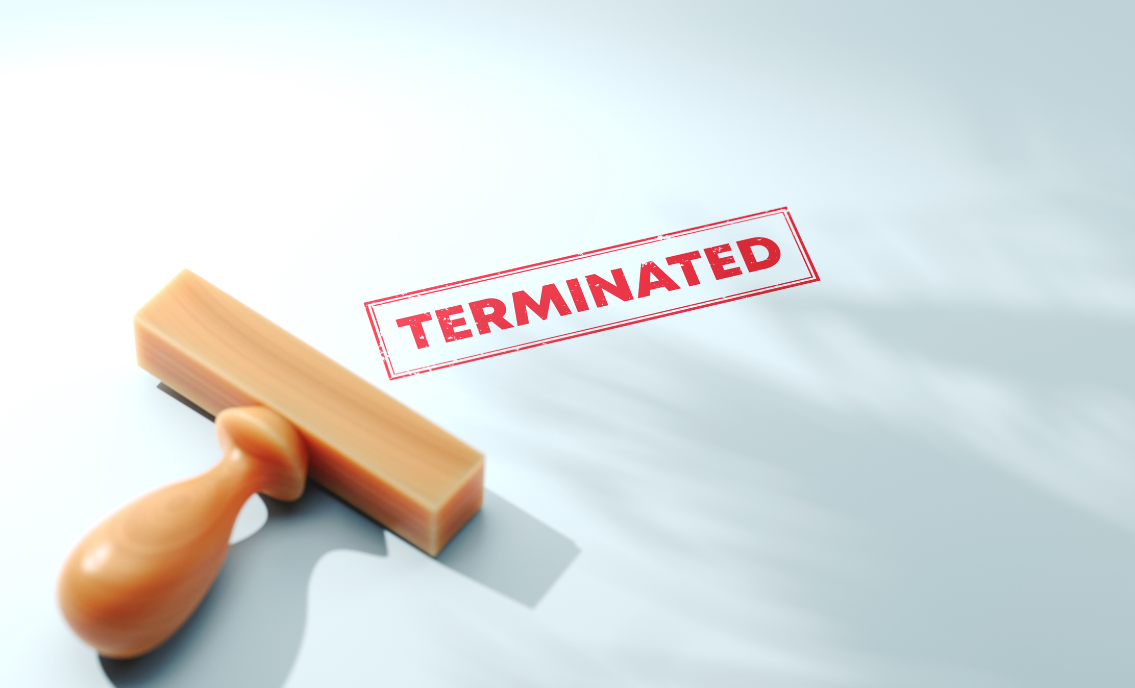 Terminated Stamp On Blue Background.