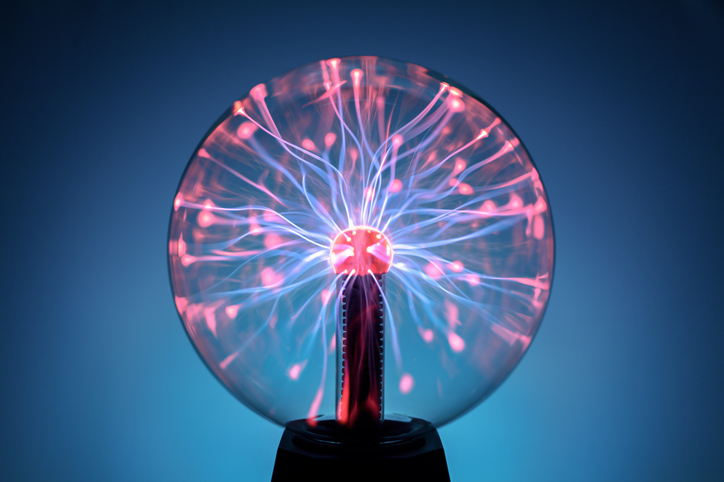 Plasma ball lamp energy, touching glowing glass sphere concept for power, electricity, science and physics background