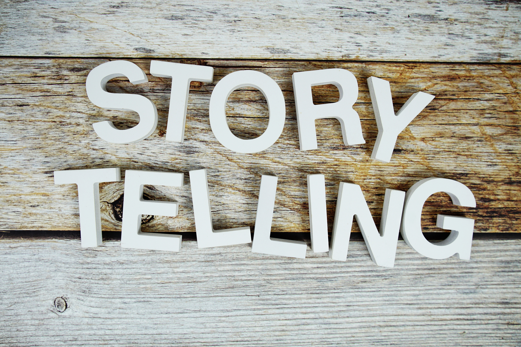 Storytelling alphabet letters on wooden background