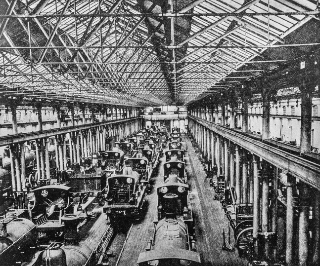 Steam engine trains in an erecting shop in Derby. Heavy industry inside a train yard in Derby from the pre-1900 book "English Illustrated Magazine" 1891-1892.