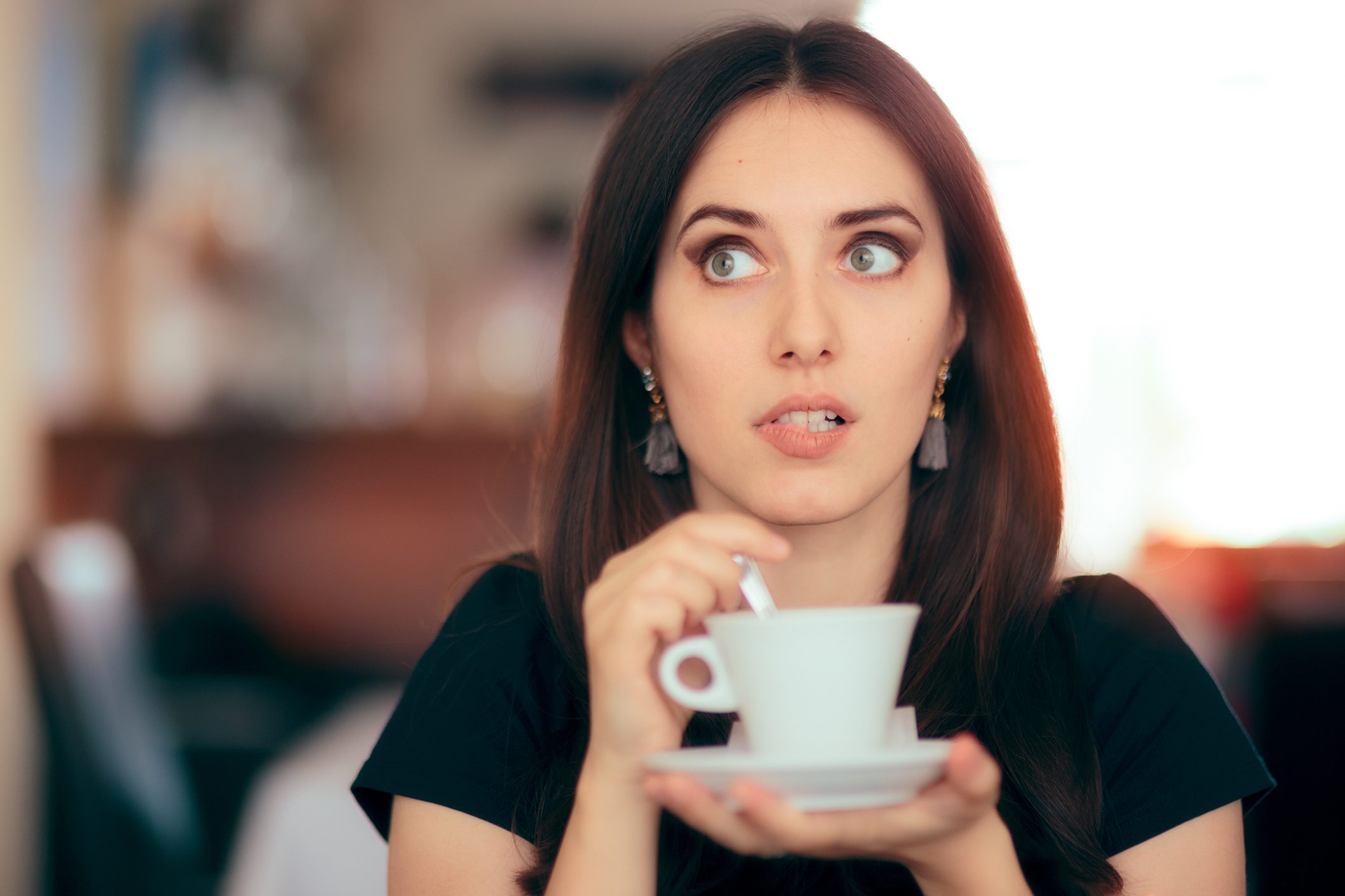 Surprised woman drinking coffee -- teacher secrets