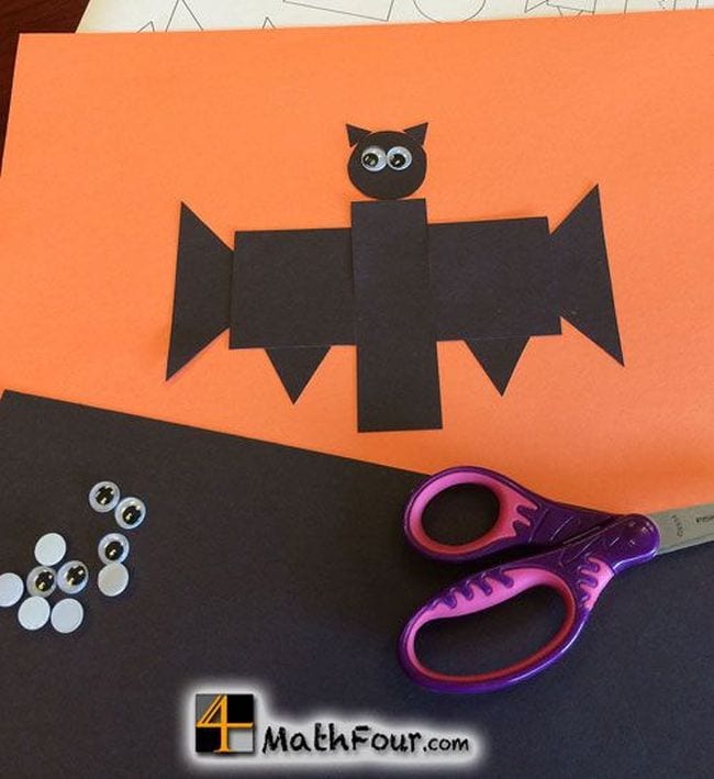 Halloween activities can include bats like this one. Construction paper bat made of geometric shapes with googly eyes and scissors