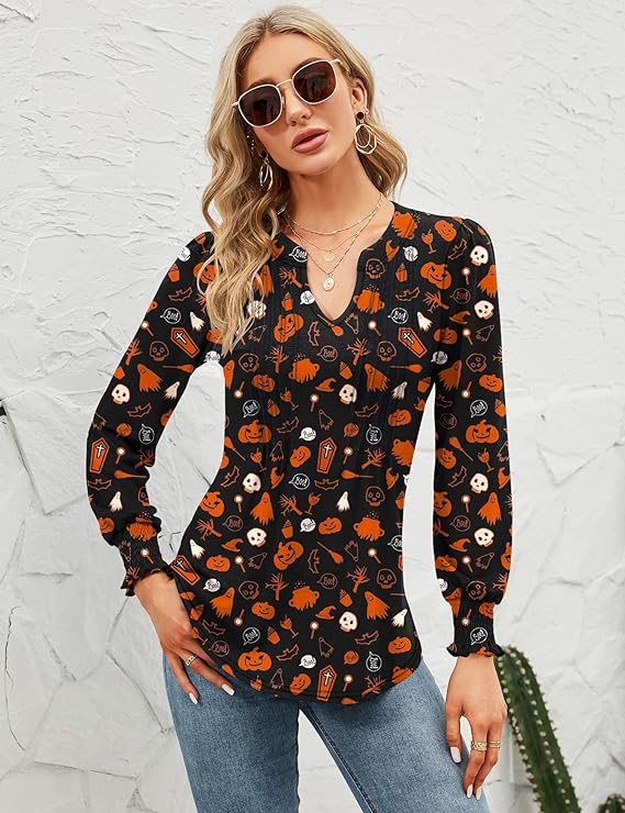 Halloween shirts can be dressy like this long sleeve black v-neck top with jack o' lanterns and other Halloween items on it.