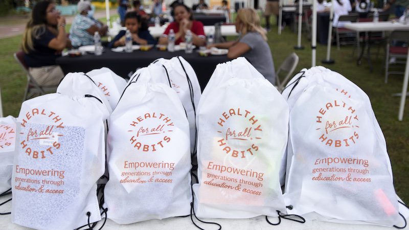 white bags that say healthy habits for all