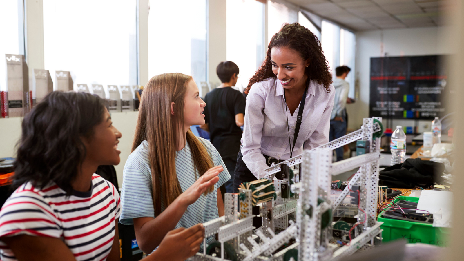 Photo of teacher and students participating in middle school career day