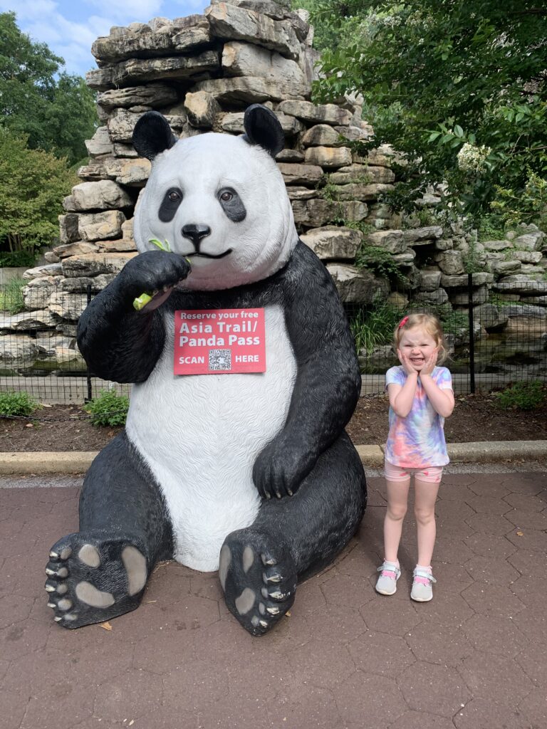 an image of a student next to a panda statue at the National Zoo