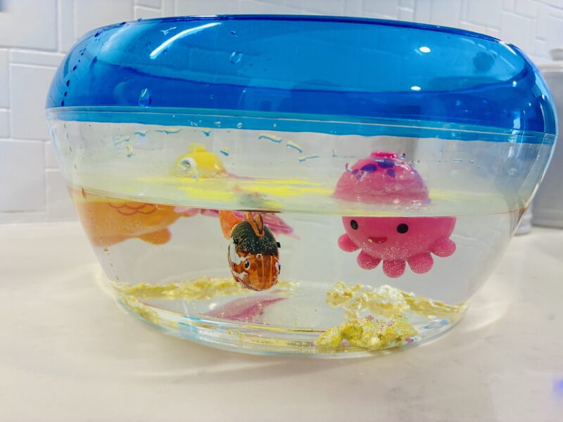 Ocean Activities for Kids a sensory bin full of water and ocean animals