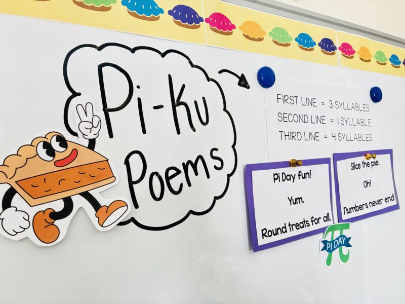 students displaying their pi-ku poems