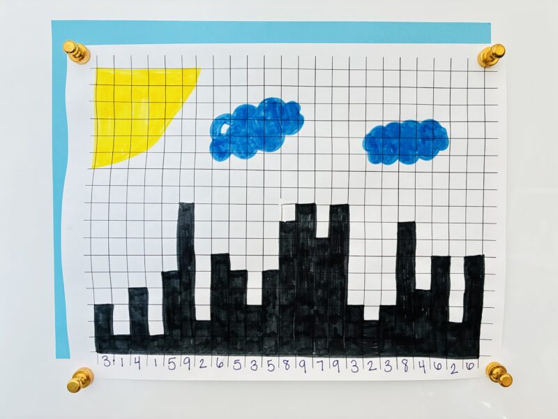 graph paper of pi that has been made into a cityscape
