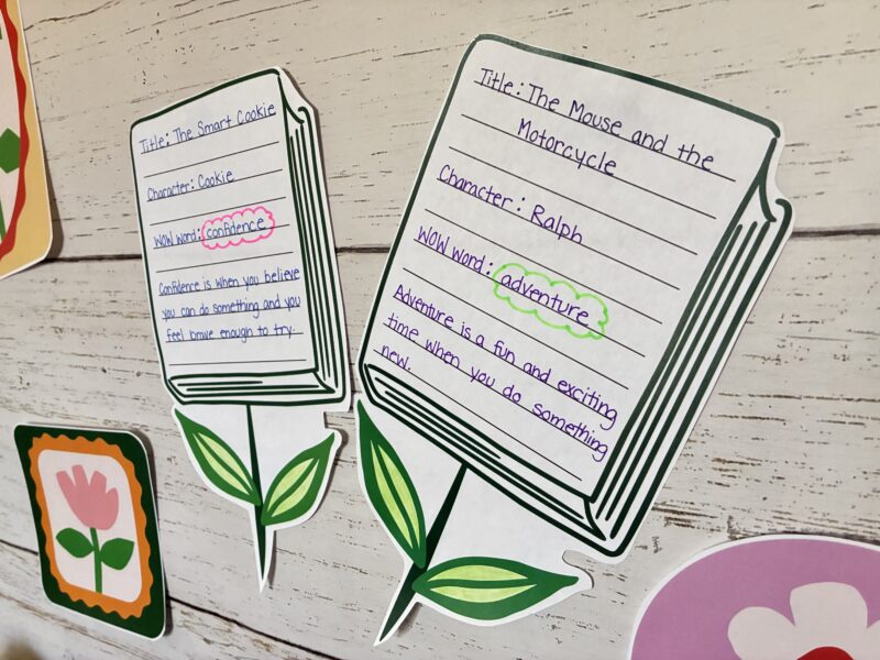 Spring Bulletin Boards an image of two student reading flowers that are a part of the spring bulletin board kit