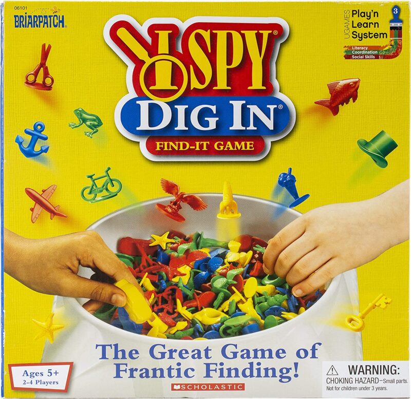 A box shows hands digging into a pile of small plastic toys. The text reads I Spy Dig In as an example of best board games for preschoolers