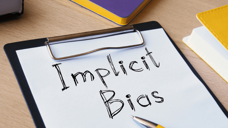 Implicit Bias written on a clipboard