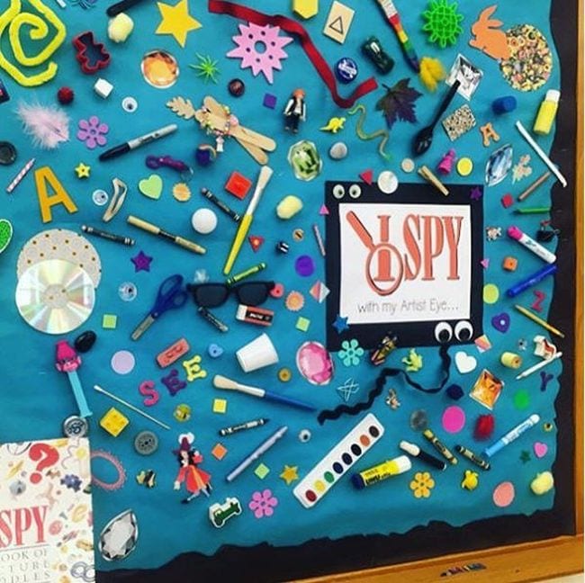 I Spy bulletin board with lots of random items attached