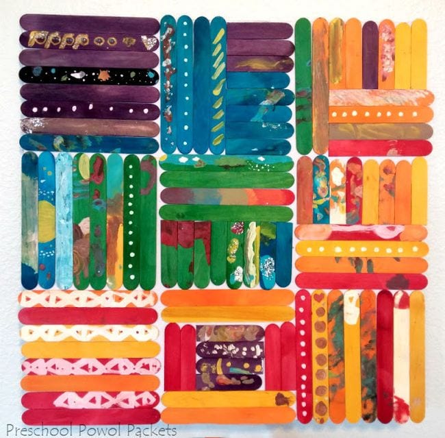 Wood craft sticks painted in vibrant colors and arranged in squares
