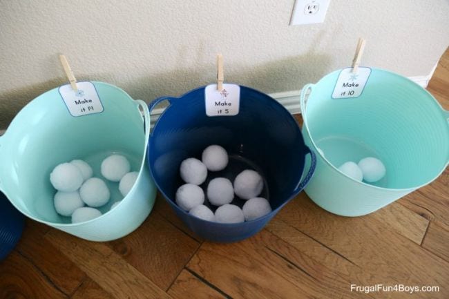 Three large plastic bins with artificial snowballs in each (Kindergarten Math Games)