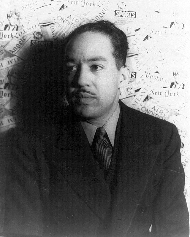 Black and white shadowy photograph of Langston Hughes 