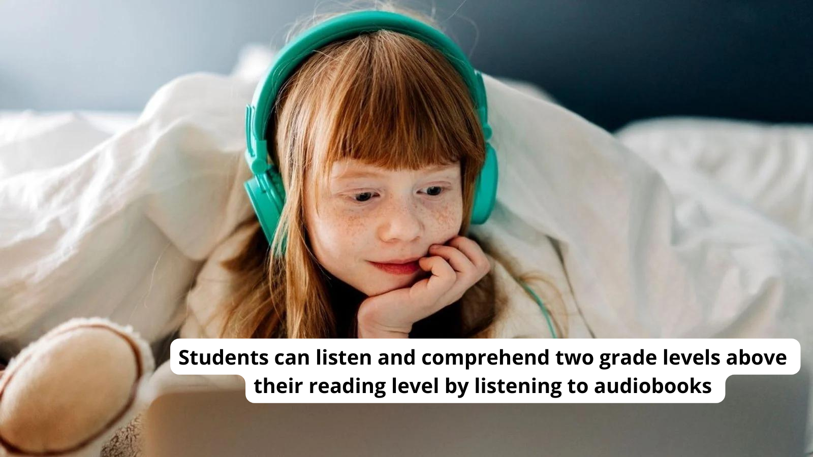 Red haired child with turquoise headphones on