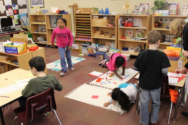 Children exploring in a Montessori classroom.