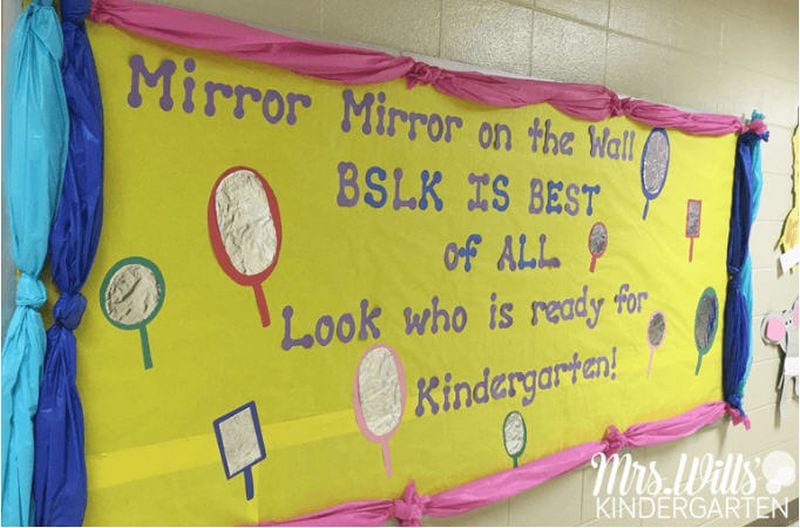 Bulletin board with mirrors made from aluminum foil. Text reads "Mirror mirror on the Wall. BSLK is best of all. Look who is ready for kindergarten!"