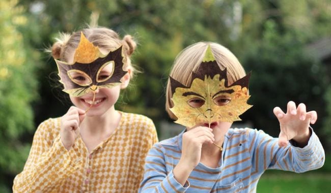 Kids wearing masks made from leaves