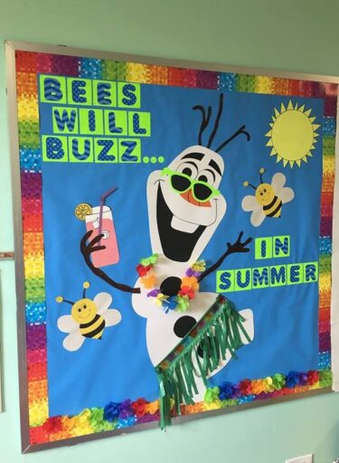 Bulletin board featuring Olaf from Frozen wearing a grass skirt and holding a lemonade. The board says 'Bees will buzz in summer.' There are bees and a sun in the background.