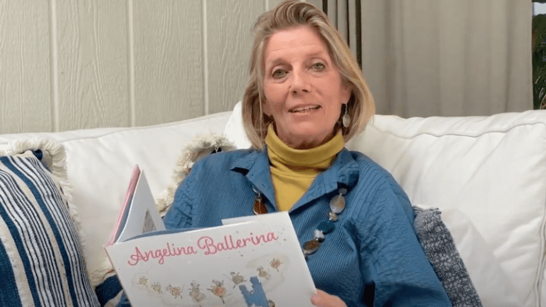 An older woman reading the Angelina Ballerina book.