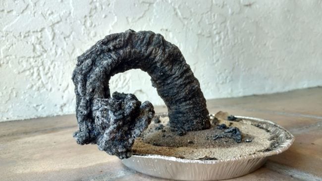 Outdoor science activities can be messy like this large carbon snake growing out of an aluminum pie plate of sand pictured. 