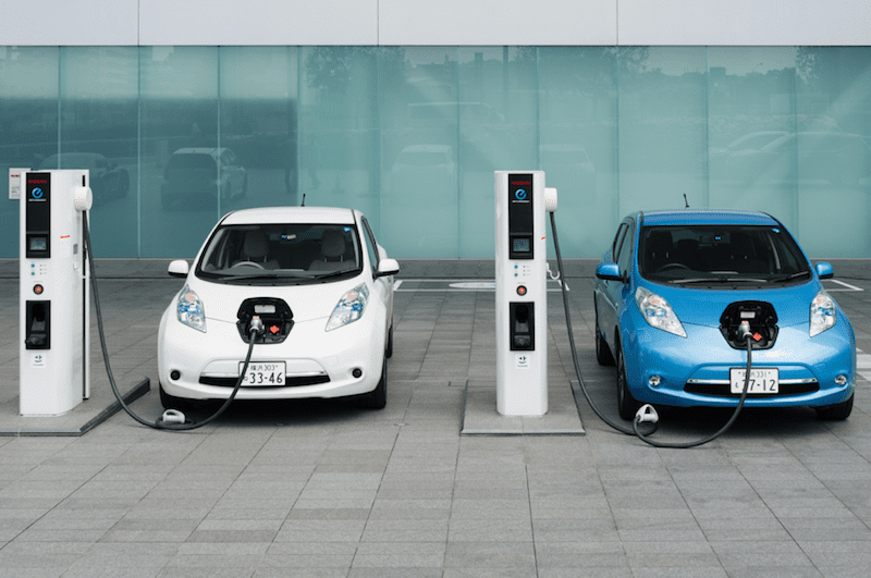 Two Electric Cars Charging - Earth Day Activities