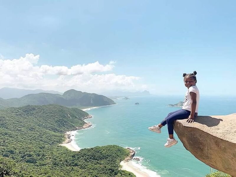 Photo of young child on a cliff