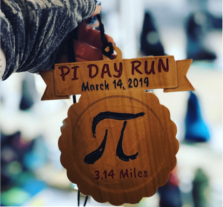 A sign for a Pi Day running event